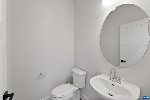 bathroom with sink and toilet