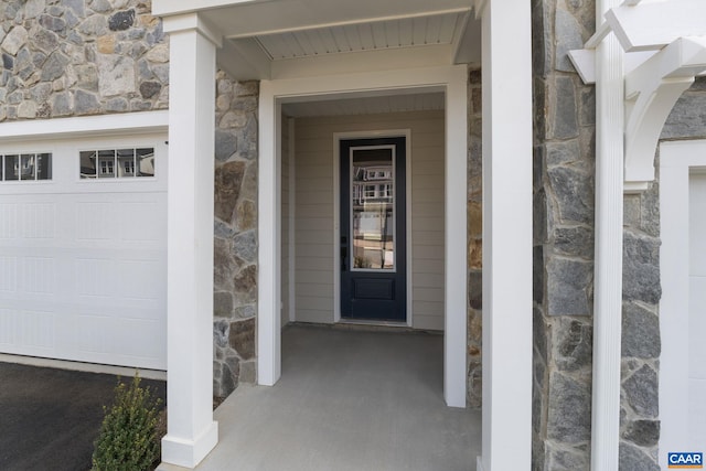 entrance to property featuring a garage