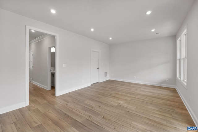 unfurnished room with light hardwood / wood-style floors