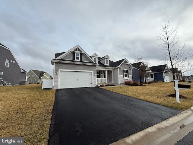 view of front facade featuring a garage and a front lawn