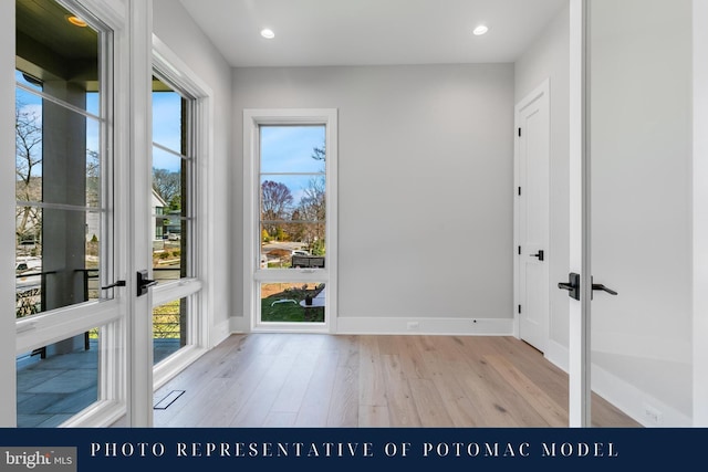 doorway featuring french doors, recessed lighting, baseboards, and light wood-type flooring