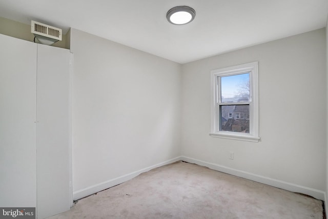 empty room featuring light colored carpet