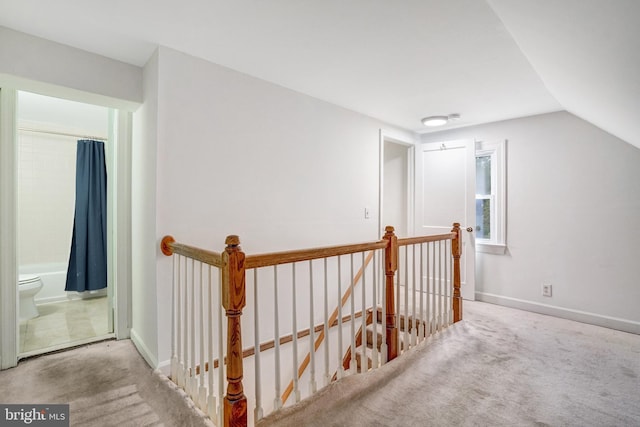 bonus room featuring light colored carpet and lofted ceiling