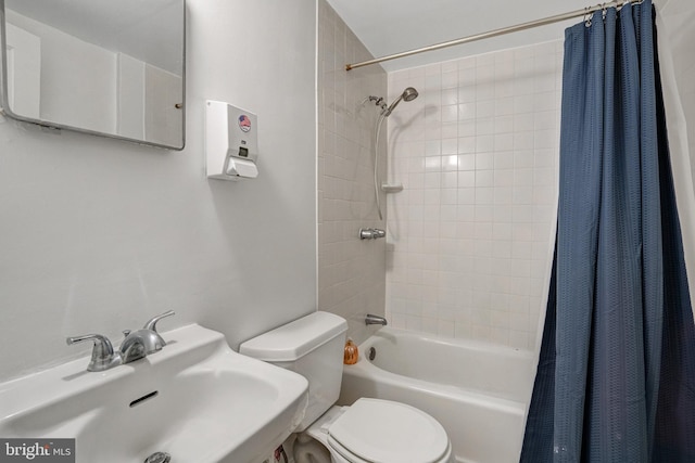 full bathroom with toilet, sink, and shower / bath combo