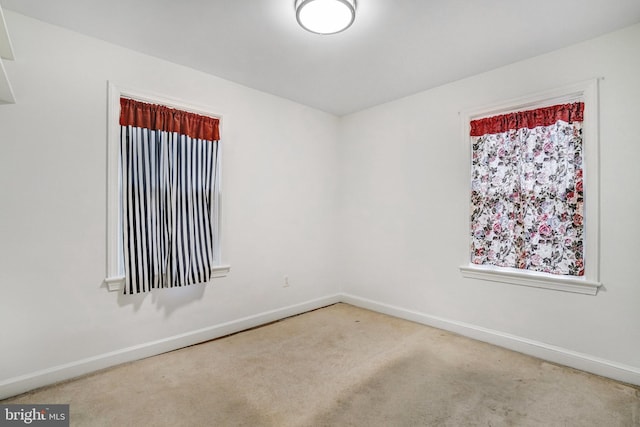 unfurnished room with carpet flooring