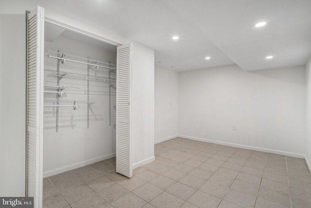 interior space featuring a closet and light tile patterned floors