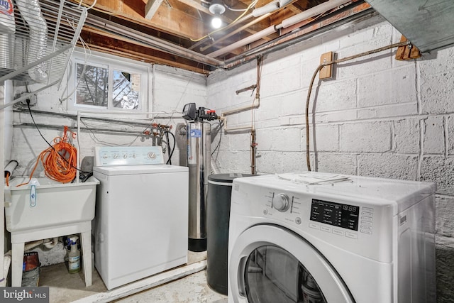 laundry area featuring sink and washer and dryer