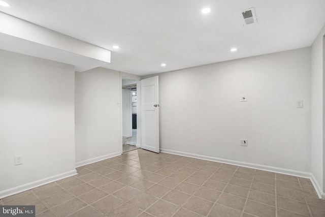 basement featuring light tile patterned flooring