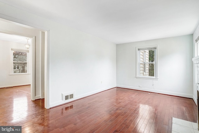 spare room with hardwood / wood-style flooring