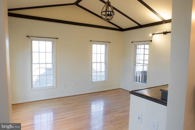 interior space featuring vaulted ceiling and light hardwood / wood-style flooring