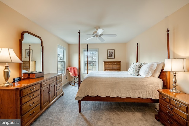 bedroom featuring ceiling fan and carpet