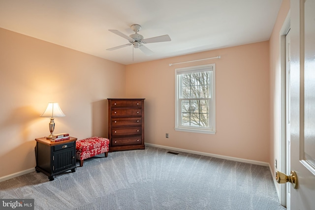 sitting room featuring visible vents, baseboards, and light colored carpet