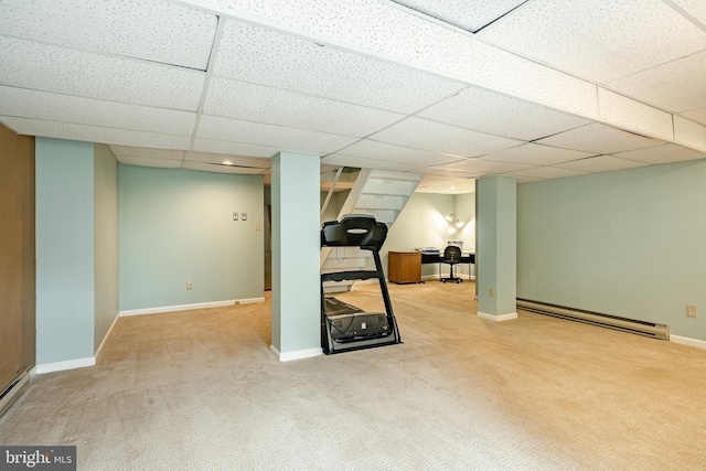 workout area with carpet flooring, baseboards, a drop ceiling, and a baseboard radiator