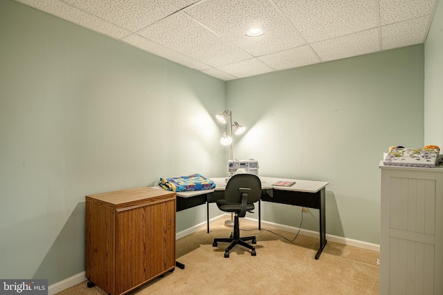 office with carpet flooring, a paneled ceiling, and baseboards