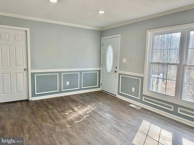 entrance foyer with a healthy amount of sunlight, visible vents, and wood finished floors