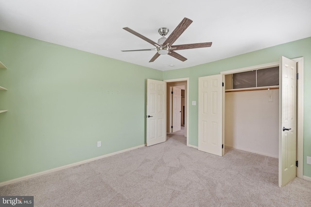 unfurnished bedroom with light carpet, a closet, and ceiling fan