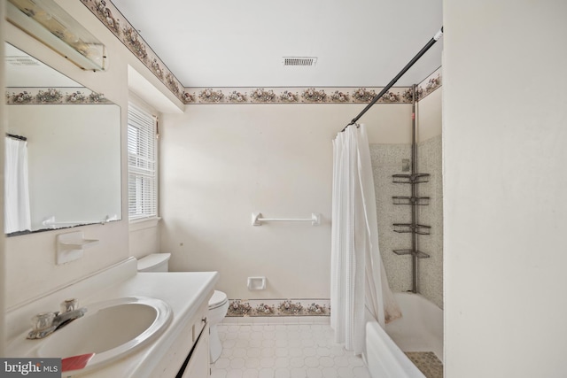 full bathroom with vanity, toilet, and shower / bath combo with shower curtain