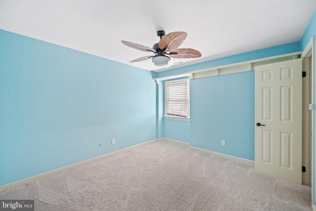 unfurnished bedroom with carpet floors and ceiling fan