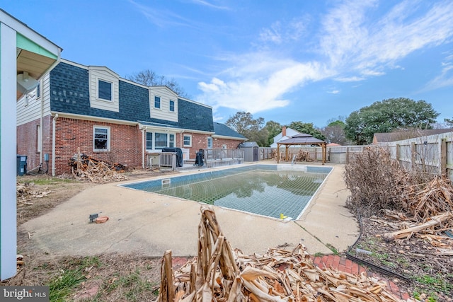 view of swimming pool featuring cooling unit, a grill, and a gazebo