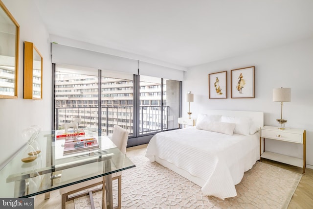 bedroom with light hardwood / wood-style flooring