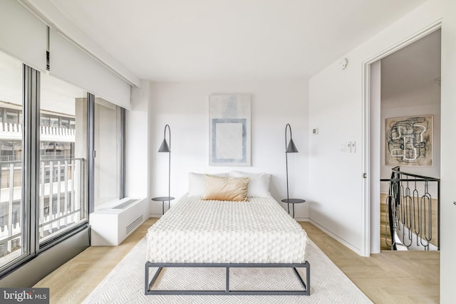 bedroom with light hardwood / wood-style floors