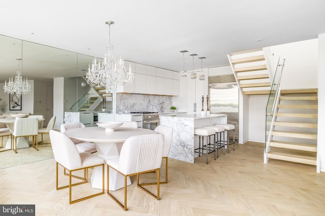 dining area featuring an inviting chandelier and light parquet floors