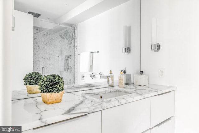 bathroom with vanity and an enclosed shower