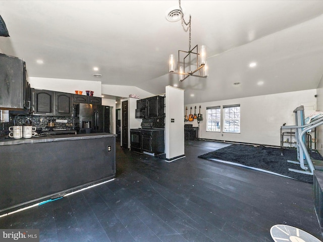 kitchen featuring visible vents, backsplash, open floor plan, black refrigerator with ice dispenser, and a notable chandelier