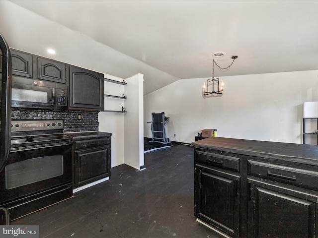 kitchen with dark countertops, hanging light fixtures, vaulted ceiling, black appliances, and a notable chandelier