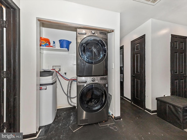 washroom with laundry area and stacked washing maching and dryer