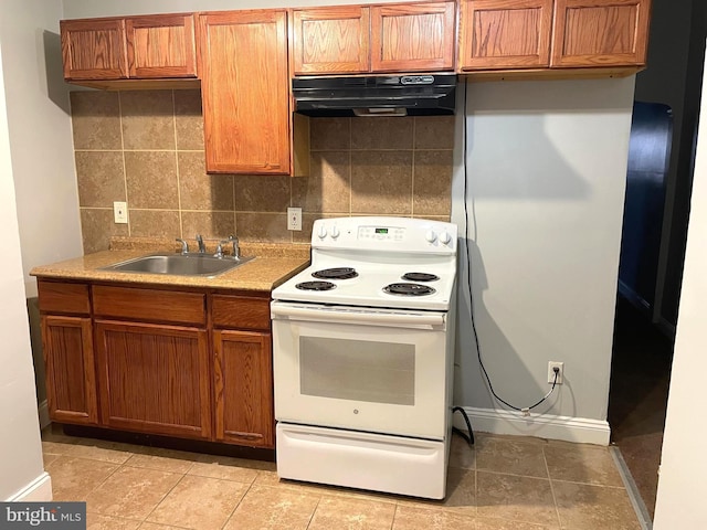 kitchen featuring electric stove, sink, light tile patterned floors, and tasteful backsplash