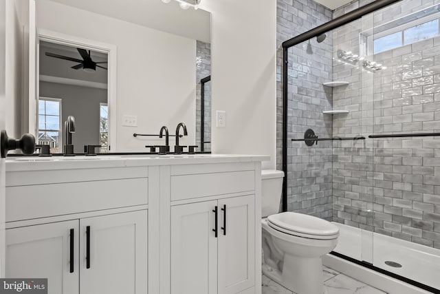 bathroom featuring walk in shower, vanity, and toilet