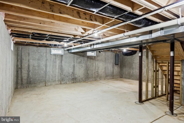 basement featuring electric panel