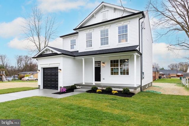 view of front of home with a garage, a front lawn, and a porch