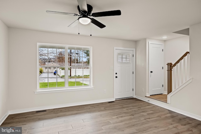 entryway with hardwood / wood-style flooring and ceiling fan