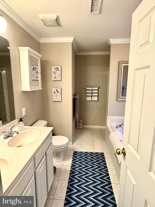 bathroom with crown molding, a tub to relax in, and toilet