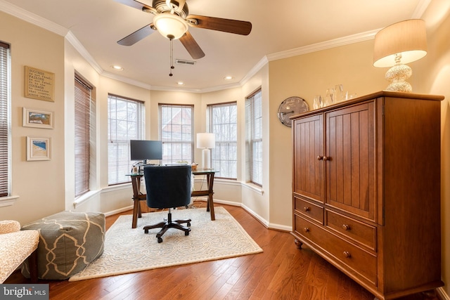 office space featuring hardwood / wood-style flooring, ornamental molding, and ceiling fan