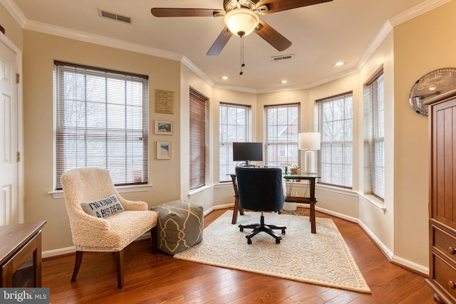 home office with hardwood / wood-style flooring, ornamental molding, and ceiling fan