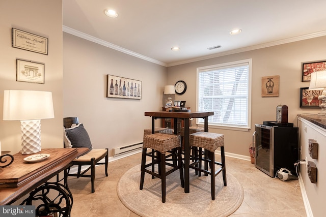 dining area with crown molding, a baseboard heating unit, and light tile patterned floors