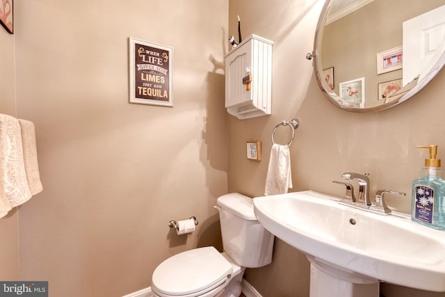 bathroom featuring sink and toilet