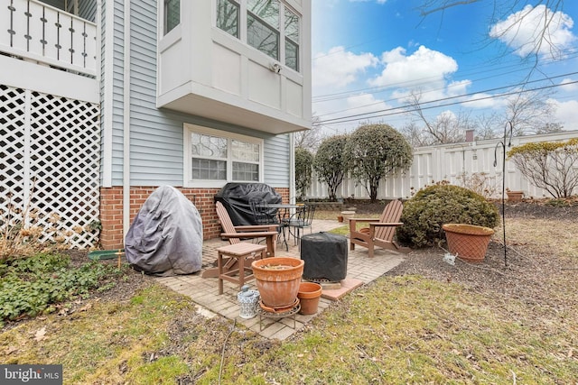 view of patio / terrace featuring a fire pit