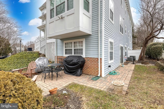 back of house featuring a patio and central air condition unit