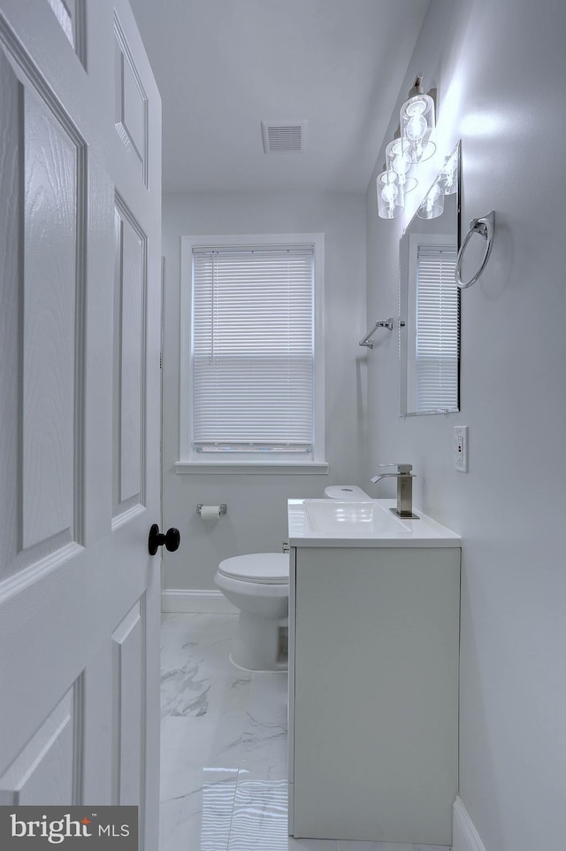 bathroom with vanity and toilet