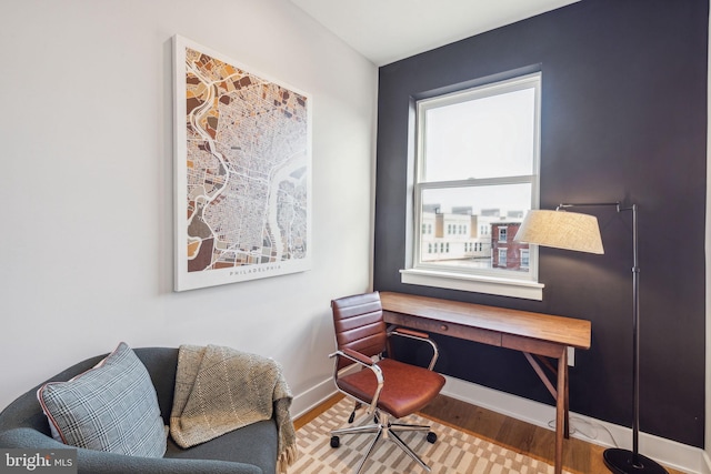 office space with wood-type flooring