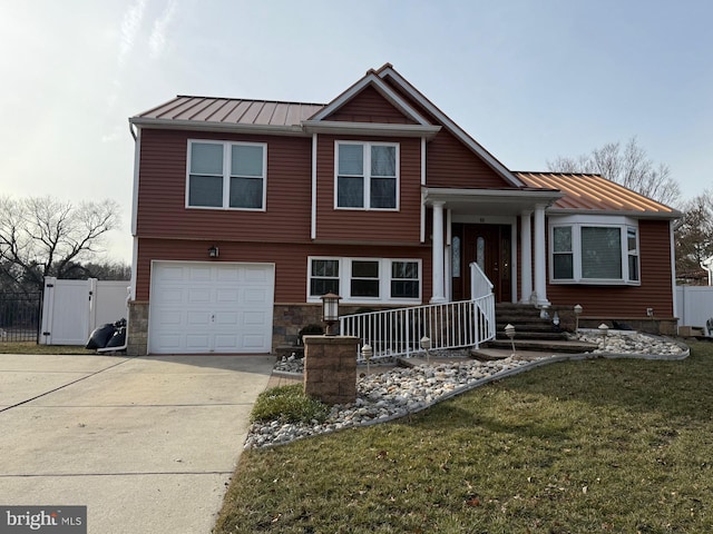 view of front facade featuring a garage and a front lawn