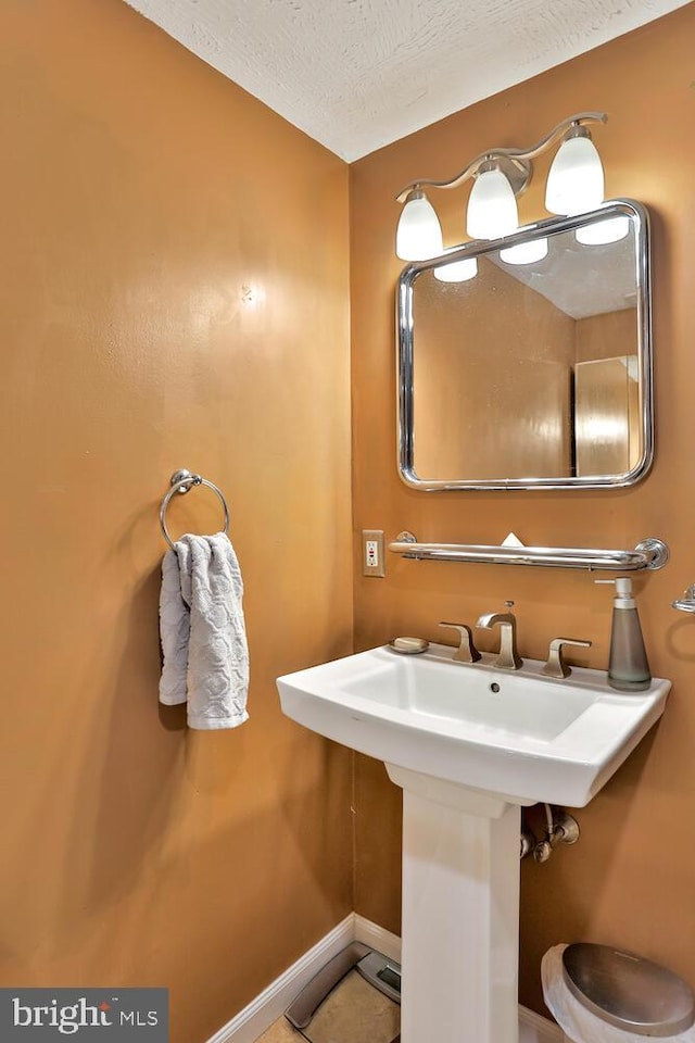 bathroom with a textured ceiling