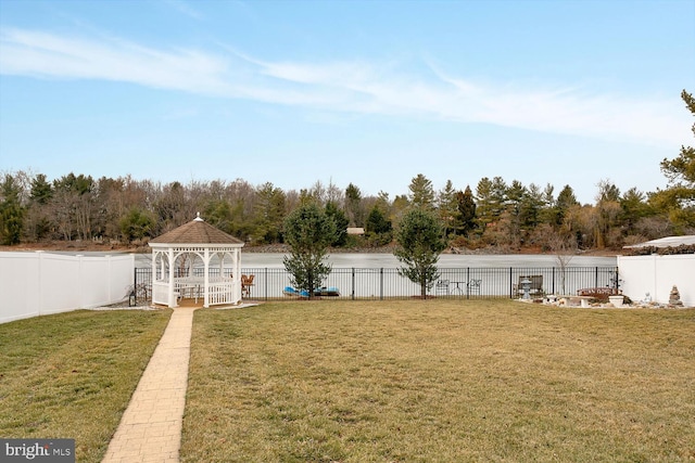 view of yard with a gazebo and a water view