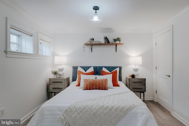 bedroom featuring hardwood / wood-style flooring and ornamental molding