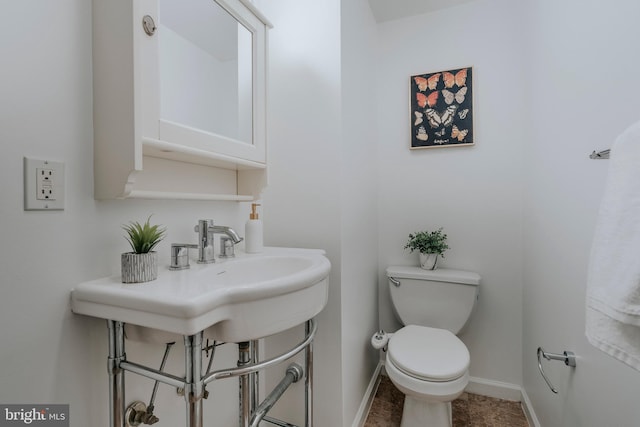 bathroom featuring toilet