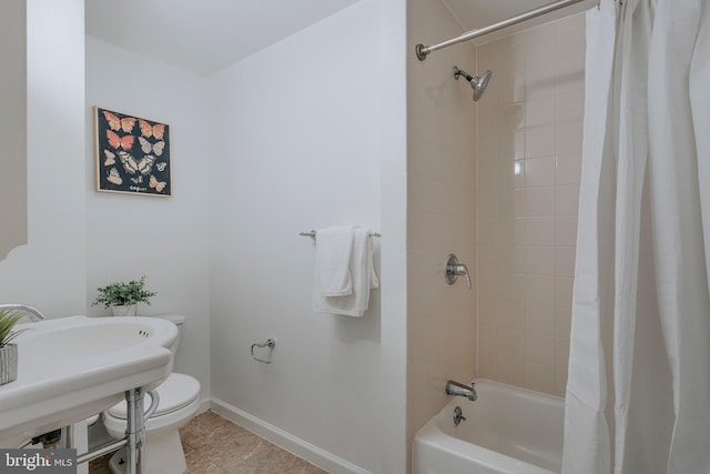 bathroom with shower / tub combo and toilet